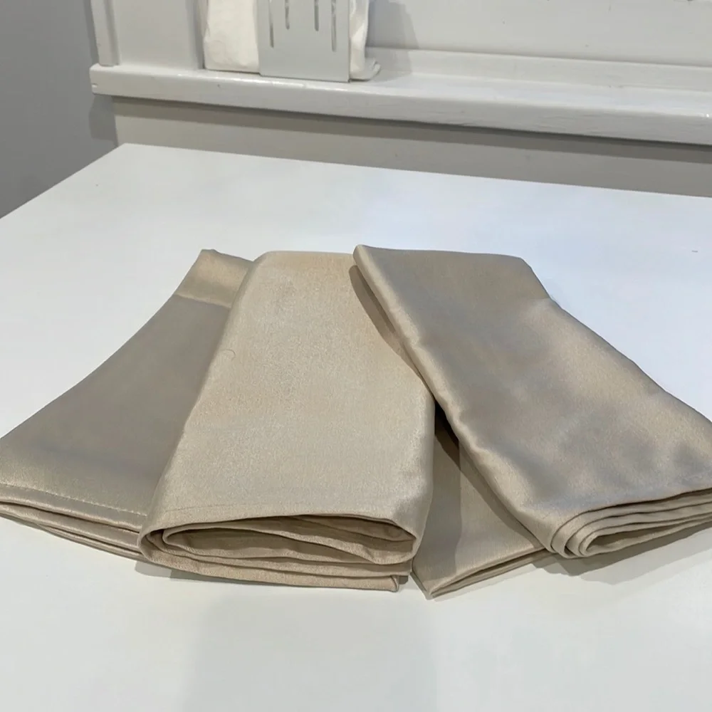 Set of 4 coated napkins in taupe. New.